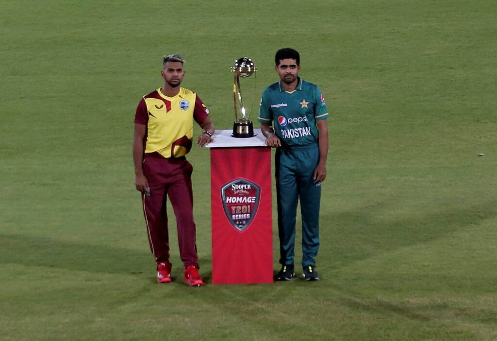 Pakistan's cricket team skipper Babar Azam, right, and his West Indies counterpart Nicholas Pooran pose for a photo with the T20 series trophy at the National Stadium, in Karachi, Pakistan, on Sunday. (AP Photo) - 