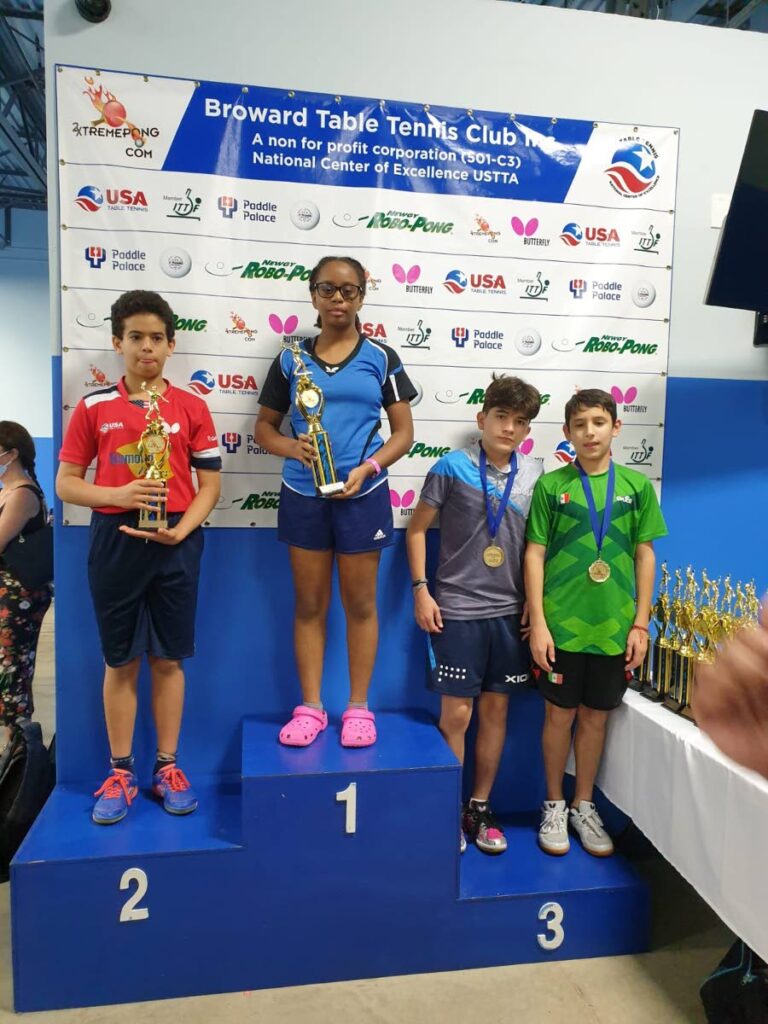 TT table tennis player Chloe Fraser, second from left, after winning a junior table tennis tournament in Florida, last weekend.  - 