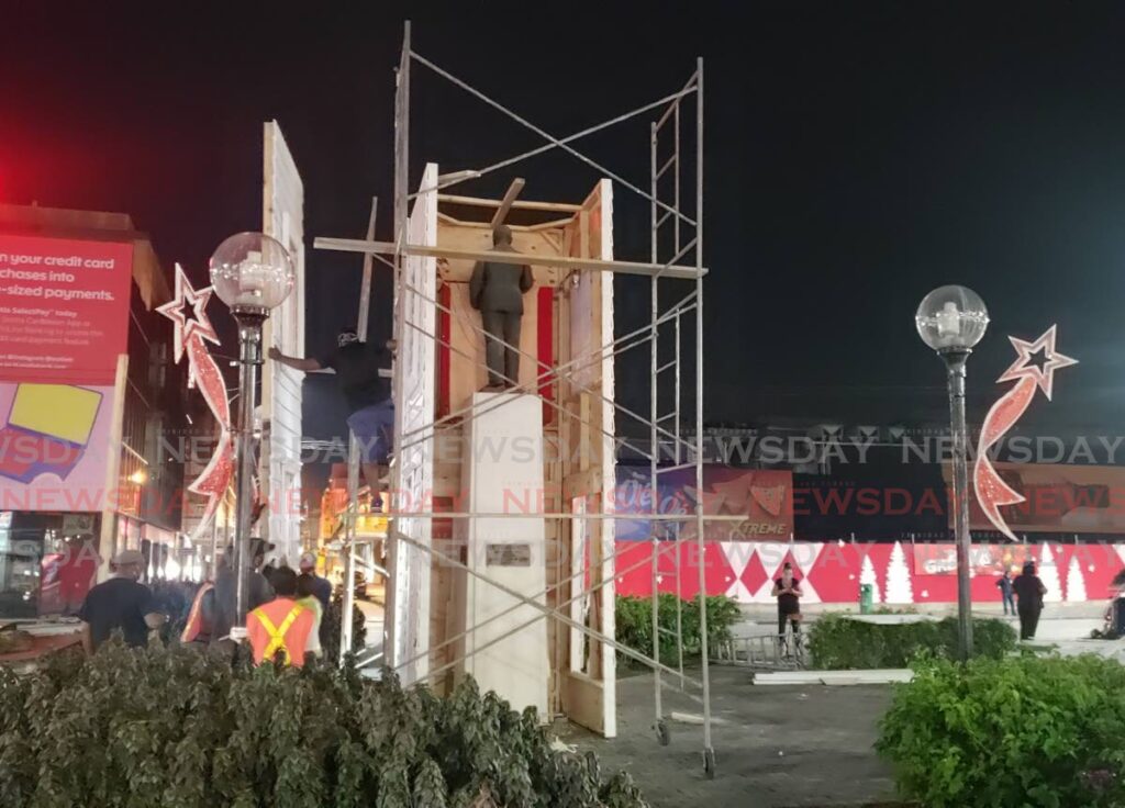 CIPRIANI UNCOVERED: Christmas decorations which covered the statute of trade unionist and former Port of Spain mayor Capt Arthur Cipriani were removed on Sunday, after several trade unions said it was disrespectful to the movement. PHOTO BY ROGER JACOB - 