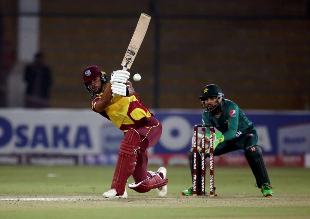 West Indies Brandon King, (left), plays a shot while Pakistan's wicketkeeper Mohammad Rizwan watches during the second Twenty20 international between Pakistan and West Indies at the National Stadium, in Karachi, Pakistan (AP PHOTO) - 