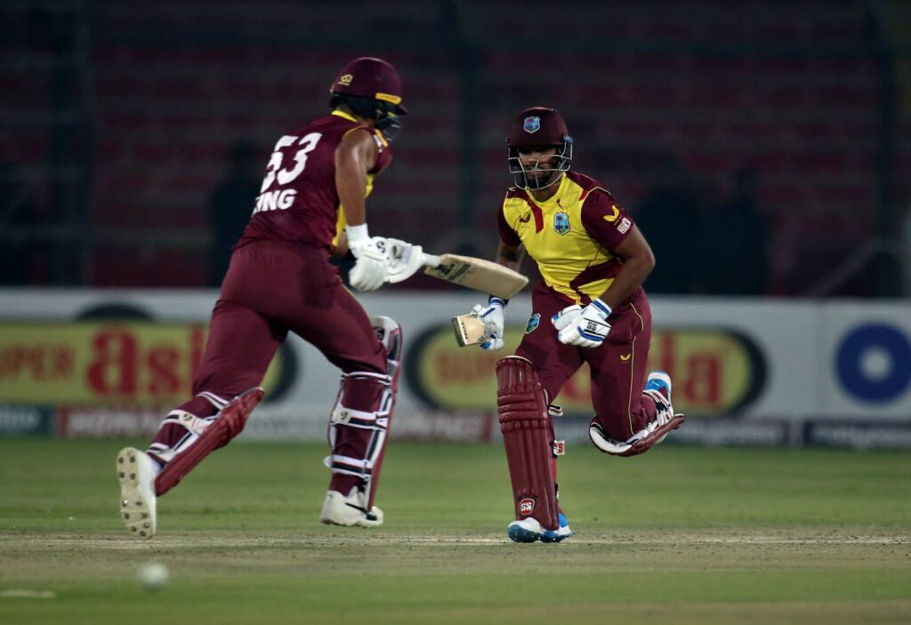 West Indies Nicholas Pooran, right, Brandon King run between the wickets during the second Twenty20 against Pakistan and West Indies at the National Stadium, in Karachi, Pakistan, on Tuesday. (AP Photo) - 