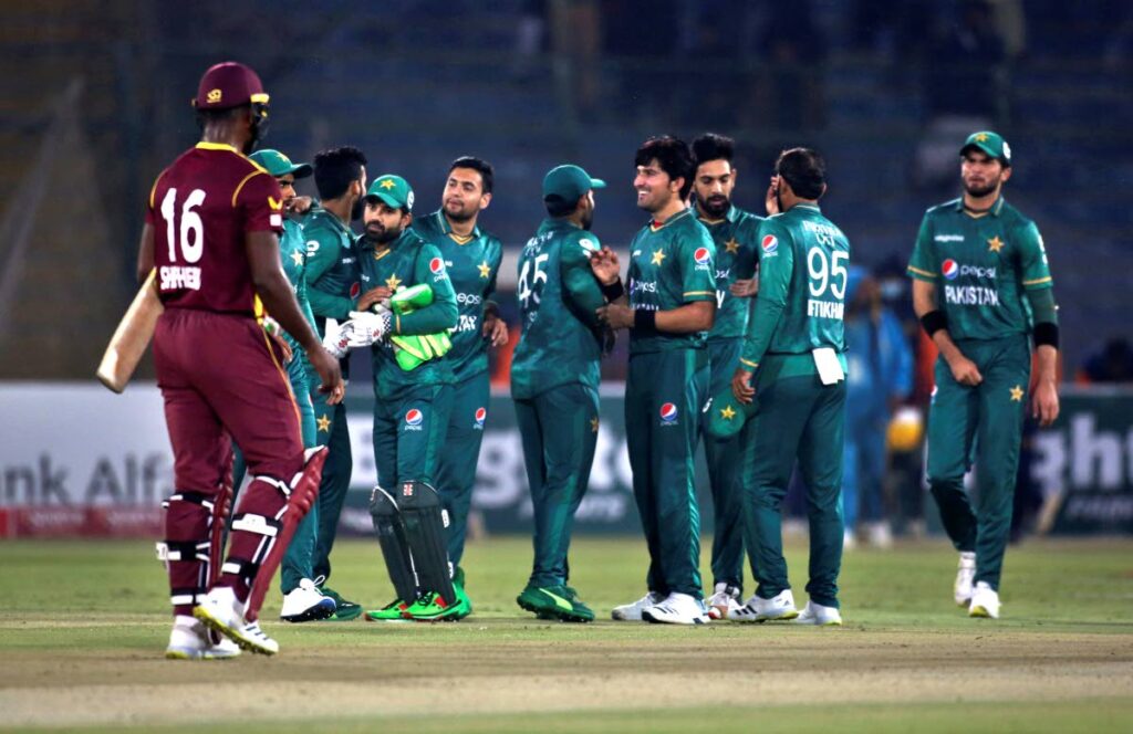 Pakistan's players congratulate each others after winning the second Twenty20 international against West Indies at the National Stadium, in Karachi, Pakistan, on Tuesday.  (AP Photo) - 