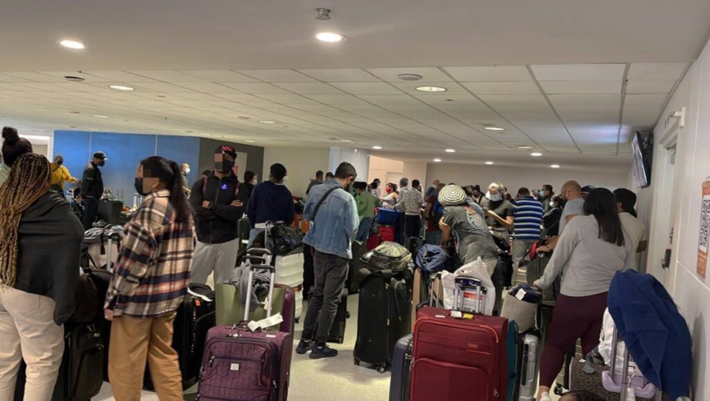 STRANDED:
This photo, taken by a passenger, shows Trinis at the check-in terminal at the Luis Munoz Marin International Airport in Puerto Rico on Tuesday afternoon. The passengers had been stranded there since Monday when their flight, at the time en route to Trinidad, was diverted to then held in Puerto Rico.
 - 