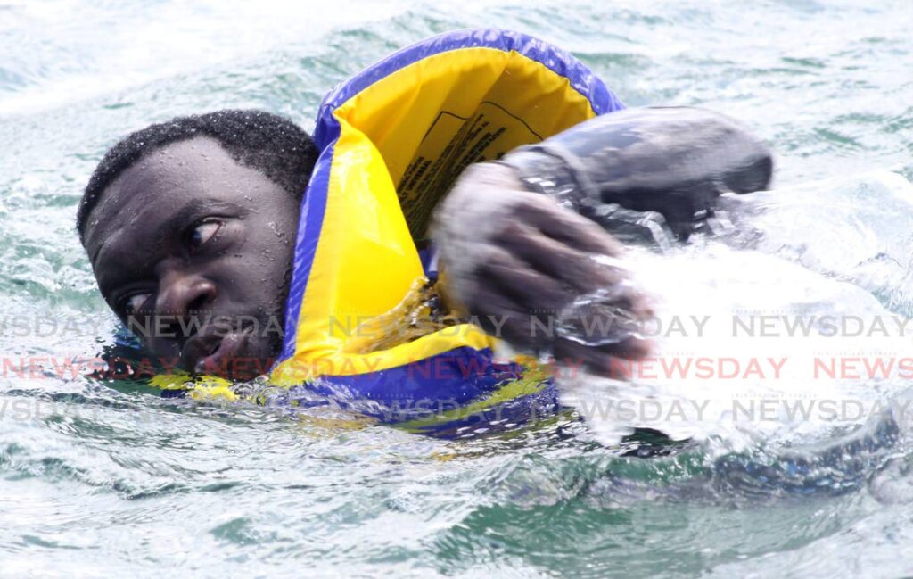 In this August 28, 2017 file photo, Watson Duke swims in waters off Toco from Tobago in protest as THA Minority Leader on sea bridge woes affecting Tobagonians. - FILE PHOTO/ANGELO MARCELLE