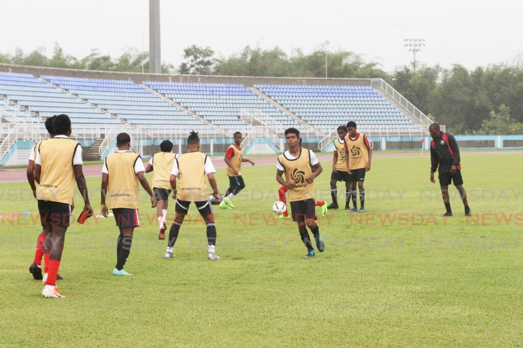 A few players are put through their paces during a tryout session for the Trinidad and Tobago Under-20 football team, on Saturday, at the Ato Boldon Stadium, Couva. - Lincoln Holder