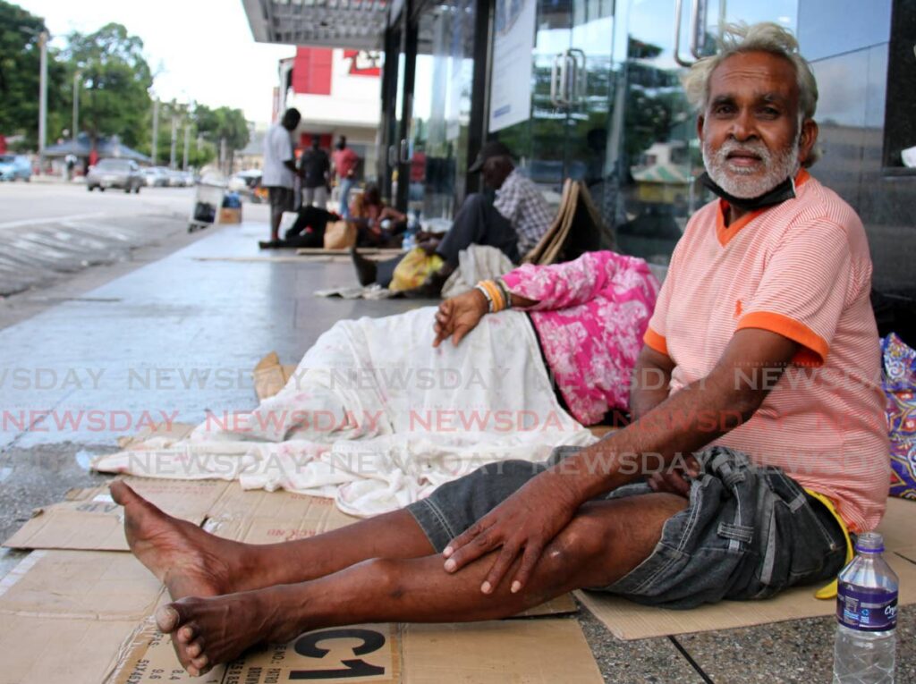 A homeless man speaks with Newsday from his pavement home in Port of Spain on Sunday. PHOTO BY AYANNA KINSALE - 