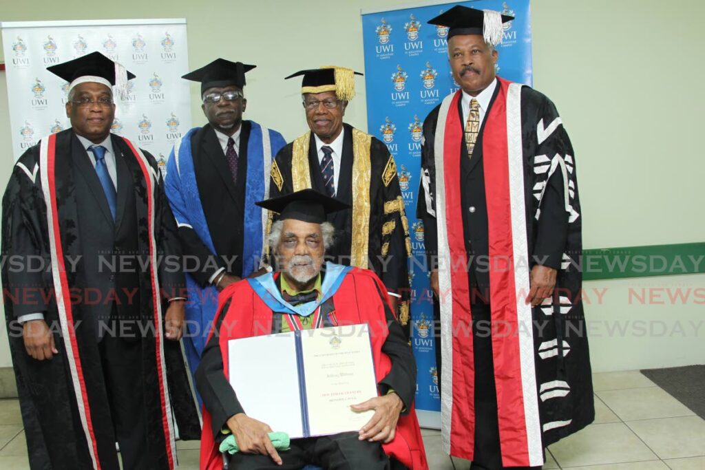 Honorary Graduate Anthony Williams, centre flanked by UWI St Augustine Campus principal – Prof Brian Copeland, left, former UWI St Augustine Campus council chair Ewart Williams, former UWI chancellor, Sir George Alleyne and UWI vice-chancellor Prof Sir Hilary Beckles at the 2016 Graduation Ceremony for the Faculty of Humanities and Education. -