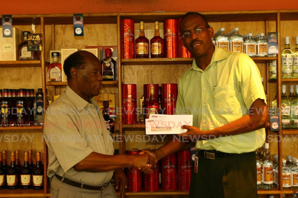 FILE: In 2008, veteran sport journalist George Baptiste, received an award from Angostura for an article on the Royal Oak Derby event at the Arima Racing Club, Santa Rosa Arima. - 
