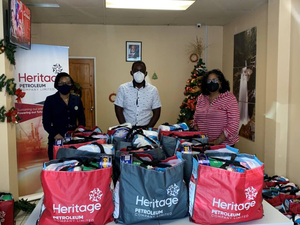 Mayor of Point Fortin Saleema McCree-Thomas, left, Heritage CEO Arlene Chow, right, and Member of Parliament for Point Fortin Kennedy Richards at the recent hamper distribution ceremony. - 