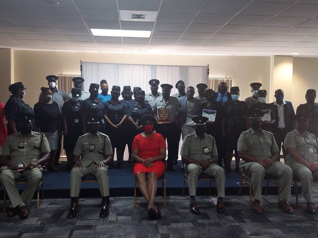 Tobago police division honoured 34 cops recently at the Penthouse of the Victor E Bruc Financial Complex in Scarborough recently.  - 
