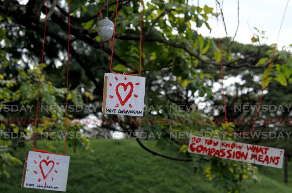 Some of the signs hanging from an African sausage tree around the Queen's Park Savannah, Port of Spain which were placed by citizens concerned about the loud fireworks during New Year's Day celebrations.  - Ayanna Kinsale