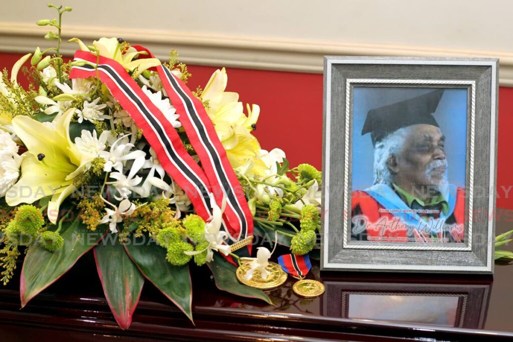 The memorial photo of Dr. Anthony Williams, alongside his national awards, the Order of the Republic of Trinidad and Tobago(ORTT) in 2008 and the Chaconia Medal (Gold) in 1992. - ROGER JACOB