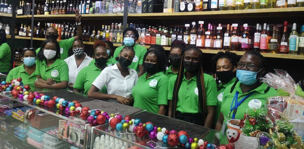 Staff at Viewport Supermarket in Scarborough celebrate winning the People's Choice Tobago award at the Supermarket Association of TT's annual awards.  - 