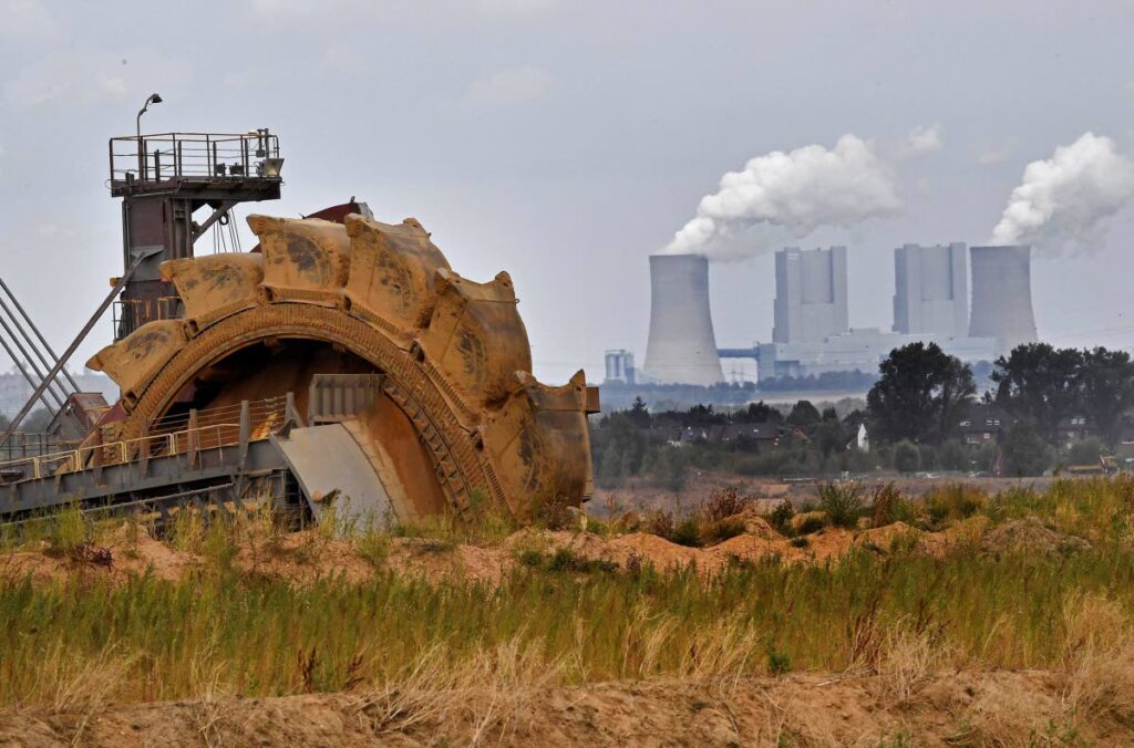 In this August 27, 2018 file photo a bucket wheel digs for coal near the Hambach Forest near Dueren, Germany. Germany's greenhouse gas emissions fell sharply last year, putting the country's 2020 climate goal within reach again.  - AP PHOTO