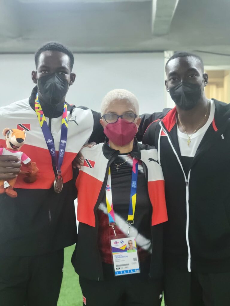 Diane Henderson, centre,  with two national athletes.