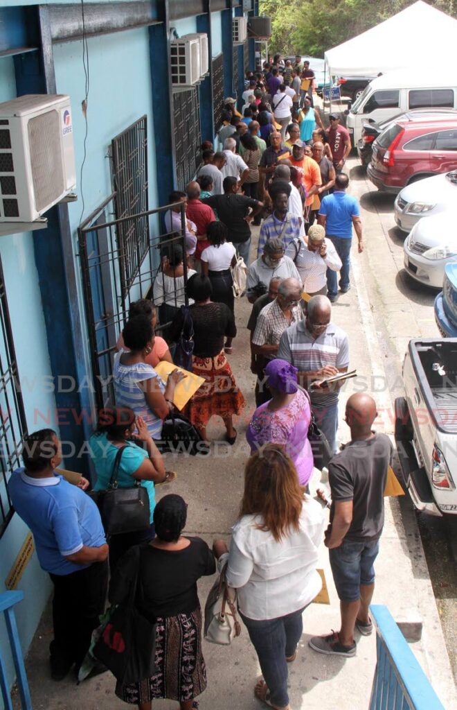 FILE PHOTO: Long lines to hand up the property tax forms at Palms Club, Point-a-Pierre Road, San Fernando, on May 15, 2017. - 