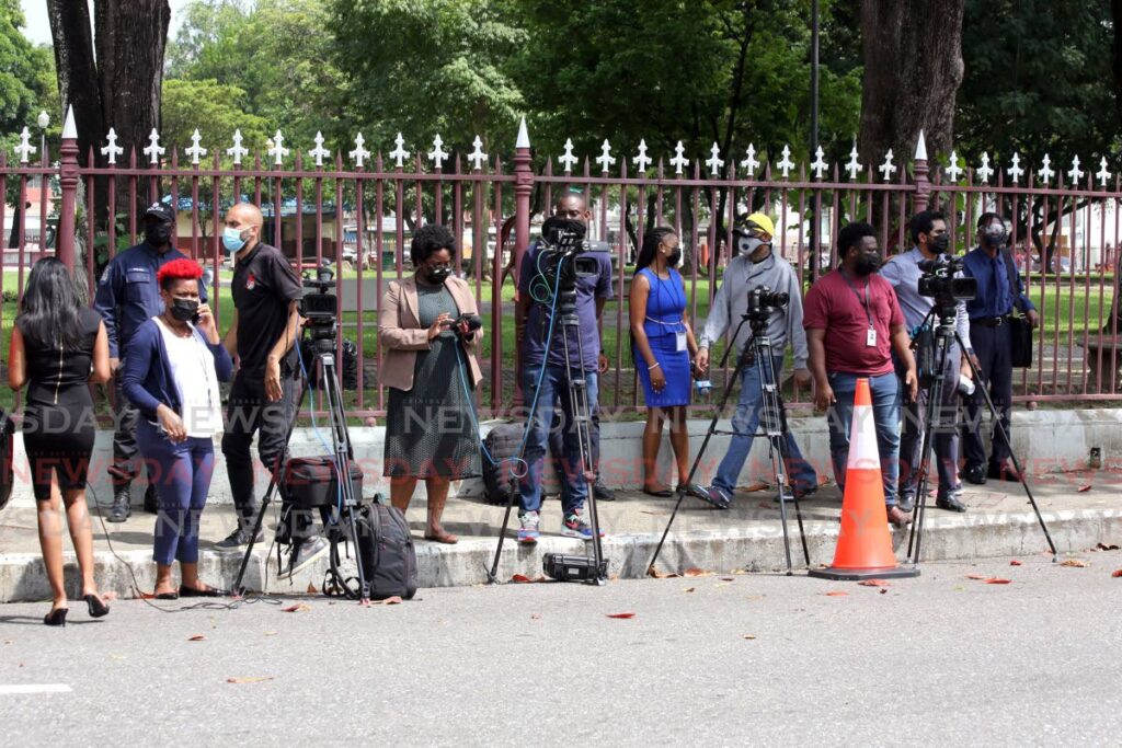 Media scrum: In this October, 2021 photo, members of the media wait outside the Red House to interview MPs after an extraordinary sitting of the House of Representatives. - FILE PHOTO/SUREASH CHOLAI