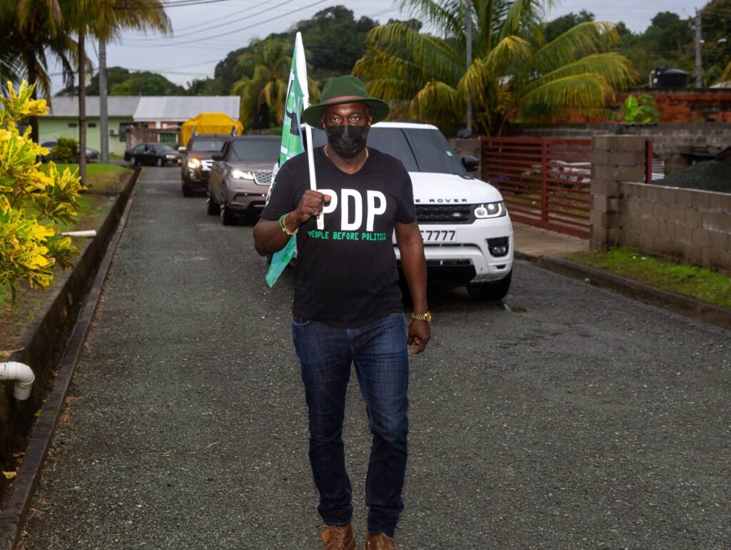 FILE PHOTO: PDP political leader Watson Duke with a PDP flag during a walkabout in Roxborough/Argyle. - 