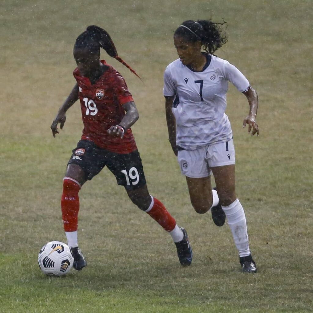 In this November 30, 2021 file photo, TT’s Kennya Cordner (L) controls the ball during the international women’s friendly against Dominican Republic, at San Cristobal, Dominican Republic. - via TTFA Media