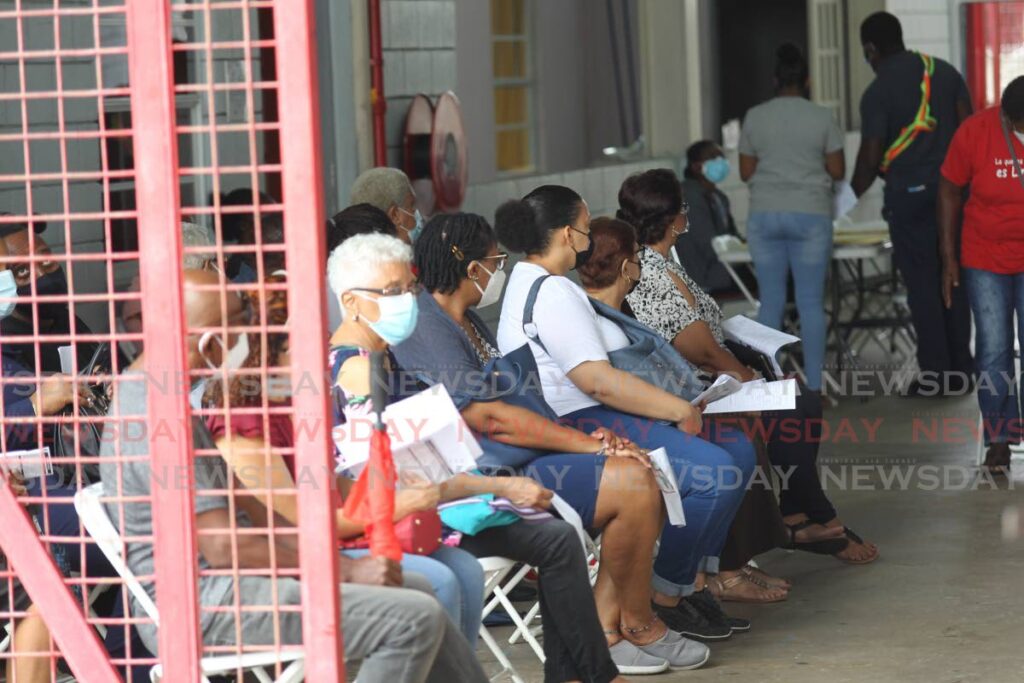 In this file photo, people wait their turn to be vaccinated against covid19 at the Larry Gomes Stadium.  - Photo by Lincoln Holder