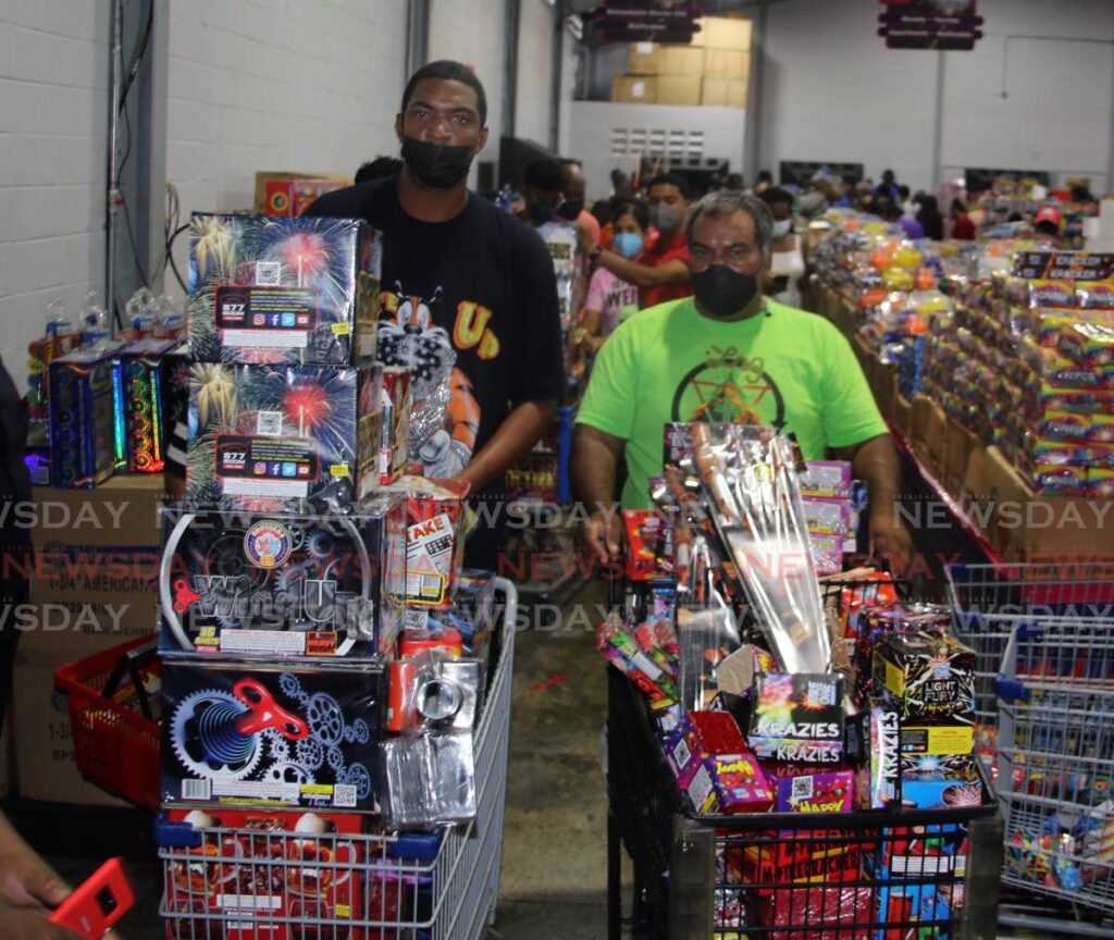 These men, with their trolley's overflowing, were part of the rush on Boxing Day last year to get fireworks. - 