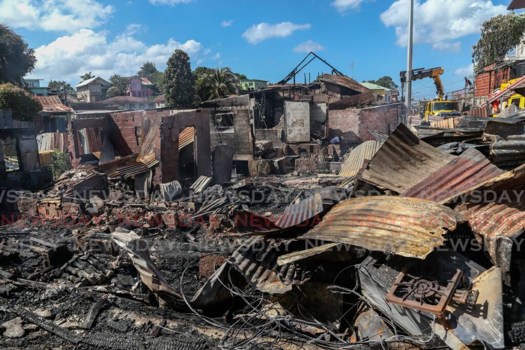 The clutter of homes destroyed by a fire at Quarry Street, Belmont on Saturday. - Photo by Jeff Mayers