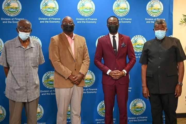 Chief Secretary Farley Augustine, second from right, with predecessors (from left) Dr Jefferson Davidson, Kelvin Charles and Hochoy Charles at the Division of Finance and the Economy, Scarborough. - 