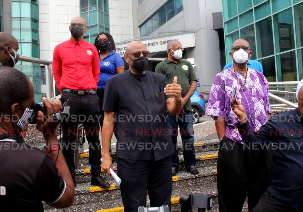 GO TO WORK: JTUM head Ancel Roget, centre, speaks to reporters outside the Office of the Attorney General in Port of Spain on Tuesday. PHOTO BY SUREASH CHOLAI - 