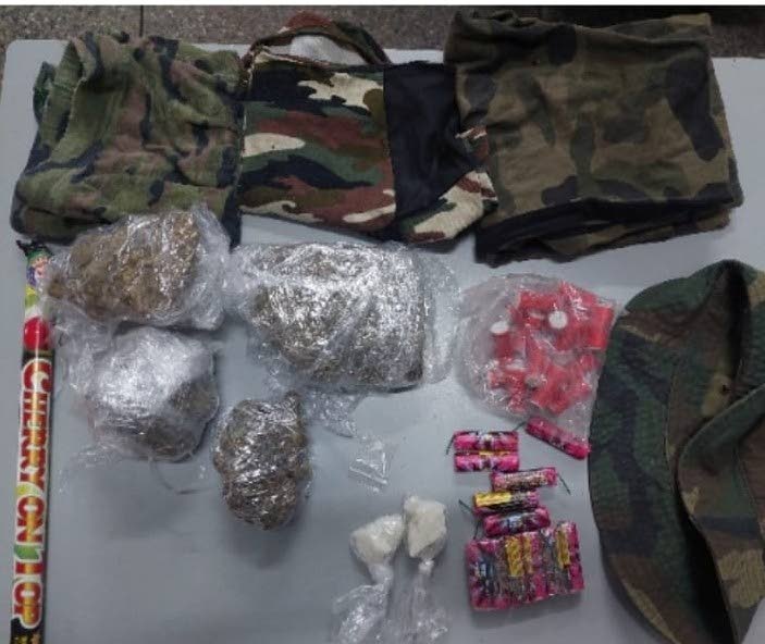 Camouflage clothing, marijuana, cocaine and fireworks were found at a house in Laventille on Wednesday afternoon. 
A 31-year-old woman was arrested in relation to the find. 

PHOTO COURTESY TTPS - PHOTO COURTESY TTPS