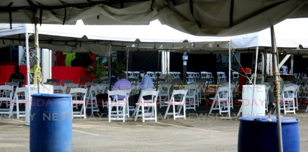 Empty chairs at the vaccination site, Paddock, Queen's Park Savannah on January 6. More vaccinations will improve the chances of fewer deaths health experts said Saturday. - FILE PHOTO/SUREASH CHOLAI