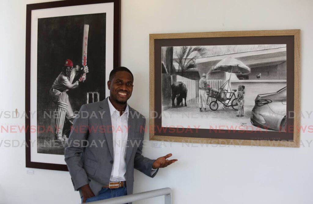 Jadon Matthews stands alongside two pieces, Backlift, left, and Animal in de place at his exhibition Tones of T&T, Arnim's Art Galleria, Tragerete Road, Port of Spain. - SUREASH CHOLAI