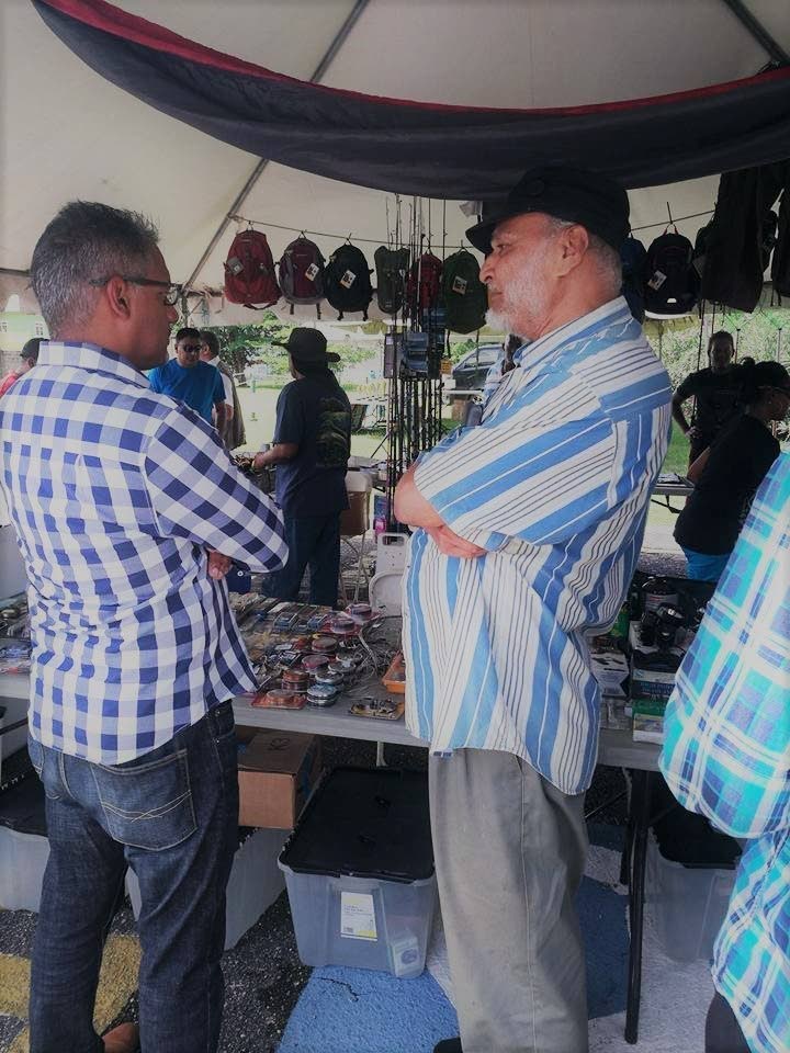In this September 2017 file photo, Minister of Agriculture, Land and Fisheries Clarence Rambharat, left, chats with Dr Reeza Mohammed at the 14th Annual Hound Show, hosted by the South Eastern Hunters Group. - Photo courtesy Ministry of Agriculture