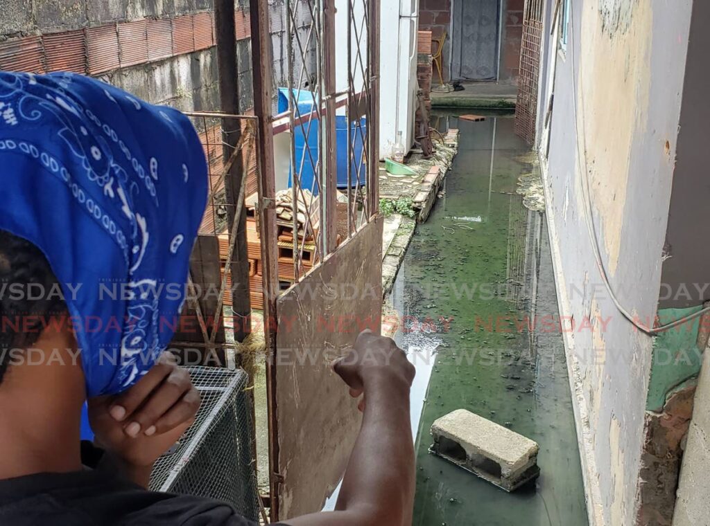 A Beetham resident shows leaking raw sewage in his home on Monday. Photo by Roger Jacob