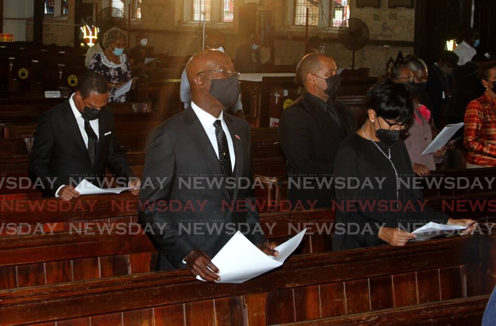 Prime Minister Dr Keith Rowley, centre, and wife Sharon Rowley, withDr Amery Bowne, Minister of Foreign and Caricom Affairs, left, at the memorial for  the late Archbishop Desmond Tutu at The Holy Trinity Cathedral of Port of Spain, Monday. - ROGER JACOB