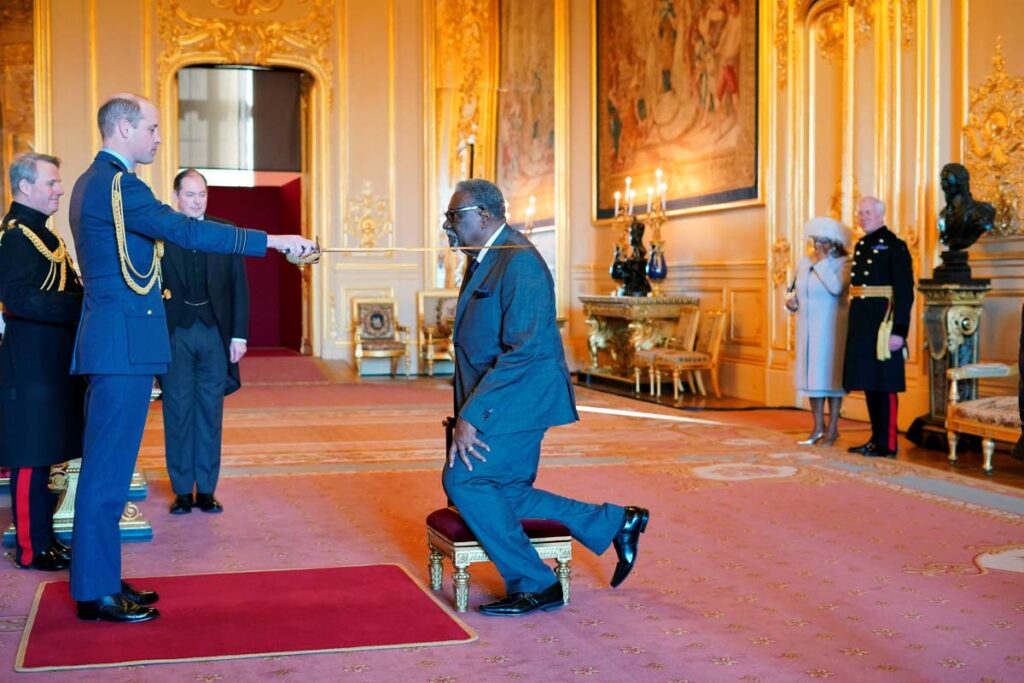 West Indies great Clive Lloyd is made a Knight Bachelor by Britain's Prince William, during an investiture ceremony at Windsor Castle, in Windsor, England, on Wednesday. (via AP) 