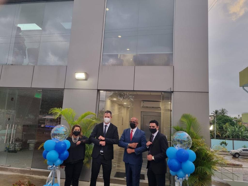 CIC Insurance Brokers managing director Mark Henderson, 2nd from left, at the opening of the company's new San Fernando office building. PHOTO COURTESY CIC INSURANCE BROKERS - CIC Insurance Brokers