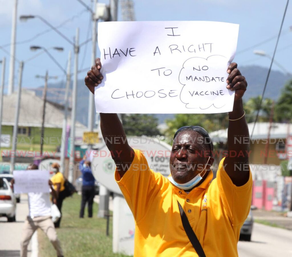 Seamen and Waterfront Workers Trade Union members, protest mandatory covid19 vaccination by the government near the National Flour Mills, Wrightson Road, Port of Spain on Friday. - Angelo Marcelle 