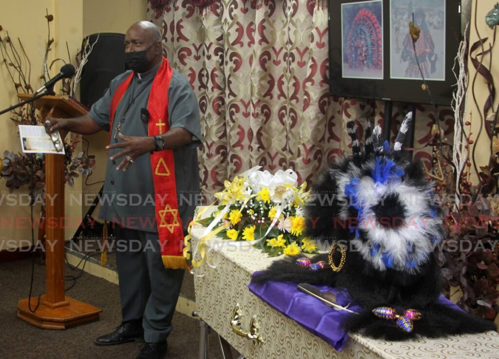 One of the headpieces worn by Black Indian masman Narine Approo was placed on his casket during his funeral service on Saturday. - ROGER JACOB