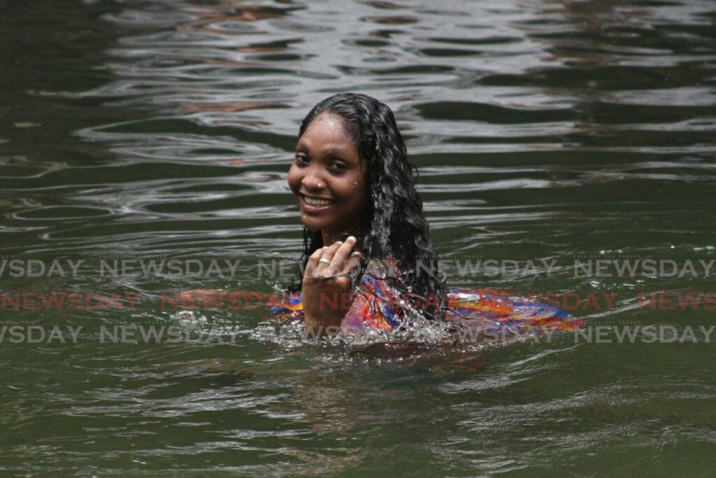 In this file photo, a woman enjoys a bath at Pool 1, Caura River.  - 
