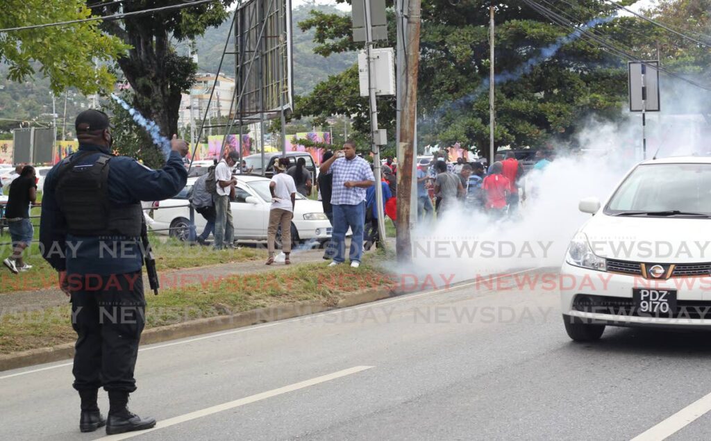 Police deploy tear gas at the First Wave Movement's protest at the Queen's Park Savannah on January 16 - 
