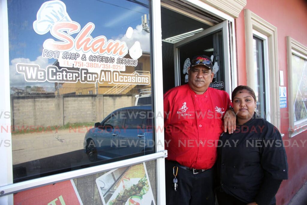 Lalchan Basdeo and daughter Sheneil Basdeo-Ramnarine, owners of Sham's Roti Shop and Catering Services, Longdenville Chaguanas. - Photo by Lincoln Holder