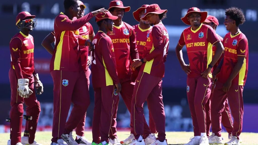 West Indies U19s huddle as they celebrate the wicket of Lyle Robertson of Scotland during the ICC U19 Men's Cricket World Cup match at Warner Park Sporting Complex on Monday, in Basseterre. - Photo courtesy ICC