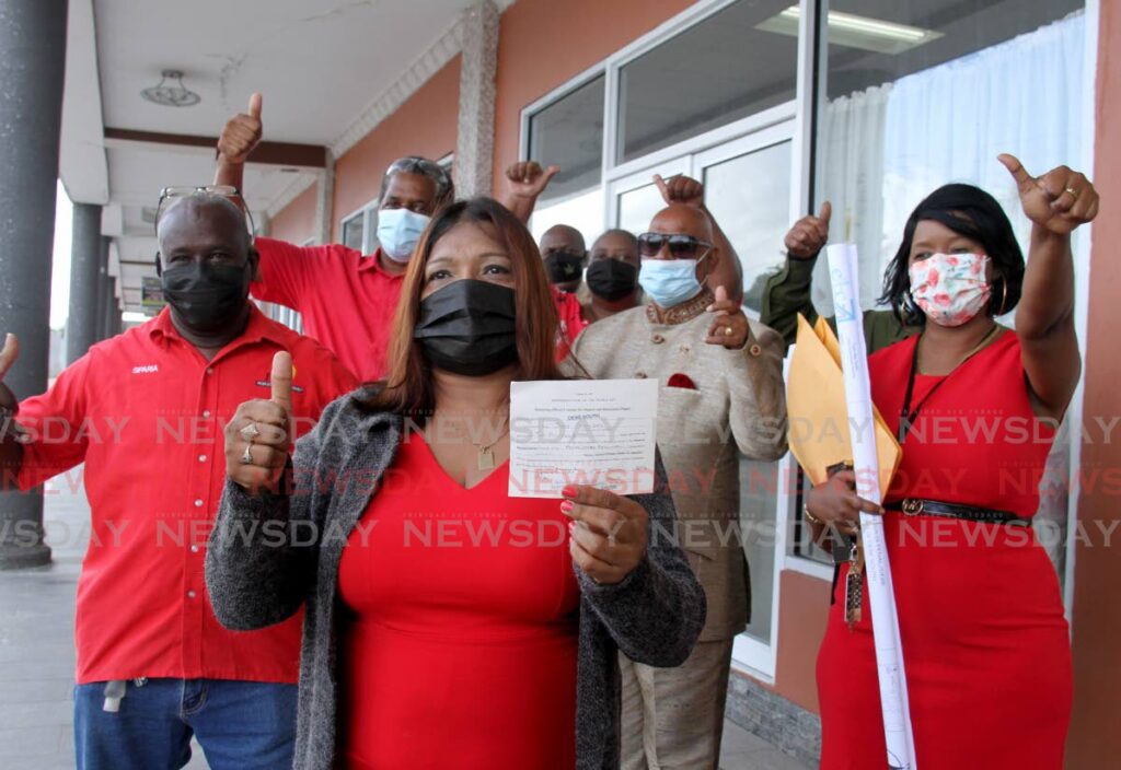 PNM candidate Judy Sookdeo gives the thumbs up after filing her nomination form on January 17 with the returning officer, at Shops of Debe, for the Debe South by-election on February 7. - AYANNA KINSALE