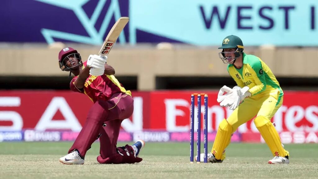 West Indies’ Mckenny Clarke plays a shot as Tobias Snell of Australia looks on during a ICC U19 Men’s Cricket World Cup match at Providence Stadium, in Georgetown, Guyana. - Photo courtesy ICC