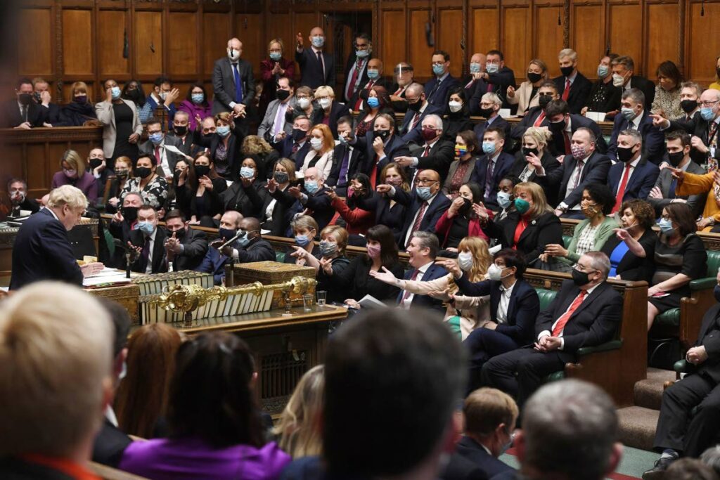  In this photo provided by UK Parliament, Britain's Prime Minister Boris Johnson speaks as members of the opposition party gesture, during Prime Minister's Questions in the House of Commons, in London, January 12, 2022. Some Conservative lawmakers in Britain are talking about ousting Johnson, who has been tarnished by allegations that he and his staff held lockdown-breaching parties during the coronavirus pandemic. The party has a complex process for changing leaders that starts by lawmakers writing letters to demand a no-confidence vote. (UK Parliament/Jessica Taylor via AP, File) - 