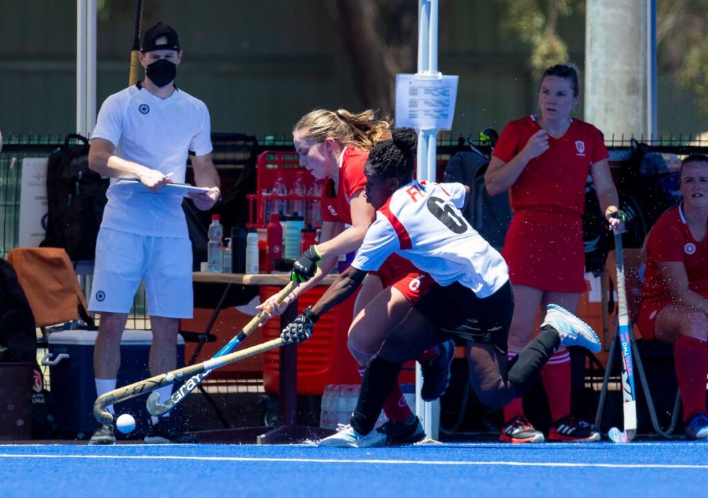 Trinidad and Tobago's Felicia King (R) amd Canada's Jordyn Faiczak vie for possession during the Pan American Cup match, on Sunday , in Santiago, Chile. - via Pan American Hockey Federation