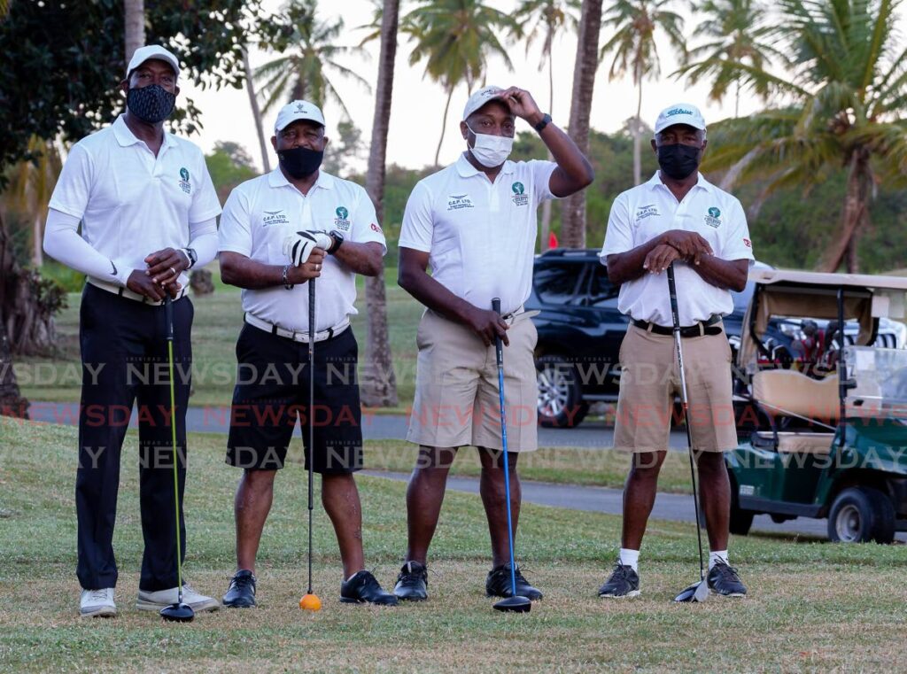 (L-R) The team ofDr Keith Rowley, Berry Ferdinand, Newman George and Barry Ferdinand are seen before the start of the 24th Annual, Prime Minister Charity Golf Classic Golf tournament at Magdalena Grand Beach &Golf Resort, Tobago, on Saturday. Photo by David Reid