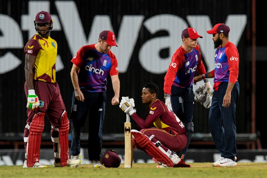 Liam Dawson (2L), Sam Billings (2R) and Adil Rashid (R) of England console Akeal Hosein (C) and Romario Shepherd (L) of West Indies after the Windies lost the 2nd T20I by one run at Kensington Oval, Bridgetown, Barbados, on Sunday. - CWI Media