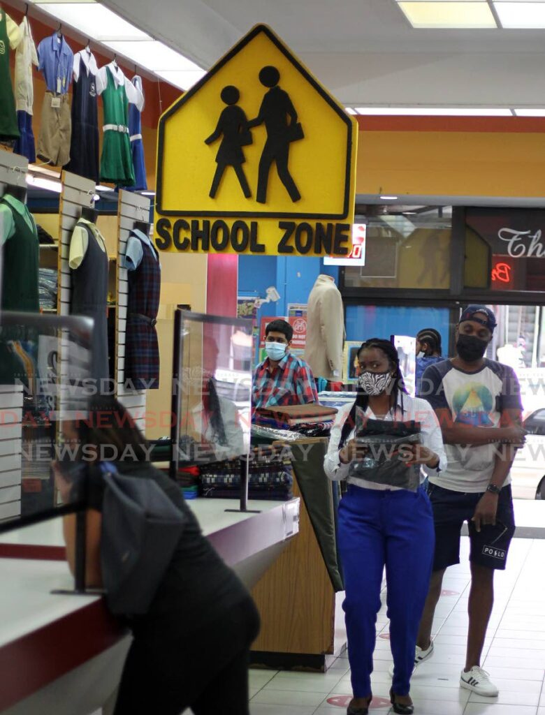 Bookstores ready their shelves for the anticipated crowds as parents search for back to school supplies ahead of the February 7 reopening for forms 1-3 students and standard five SEA students. Bradford City Mall, Henry Street Port of Spain. - Photo by Roger Jacob