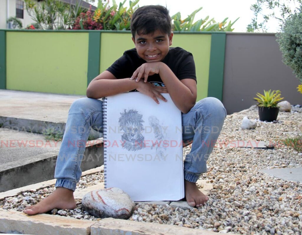 Eli Dhaniram-Gopaul with one of his pencil drawings. He says he was inspired by his 12-year-old uncle to start sketching. - AYANNA KINSALE